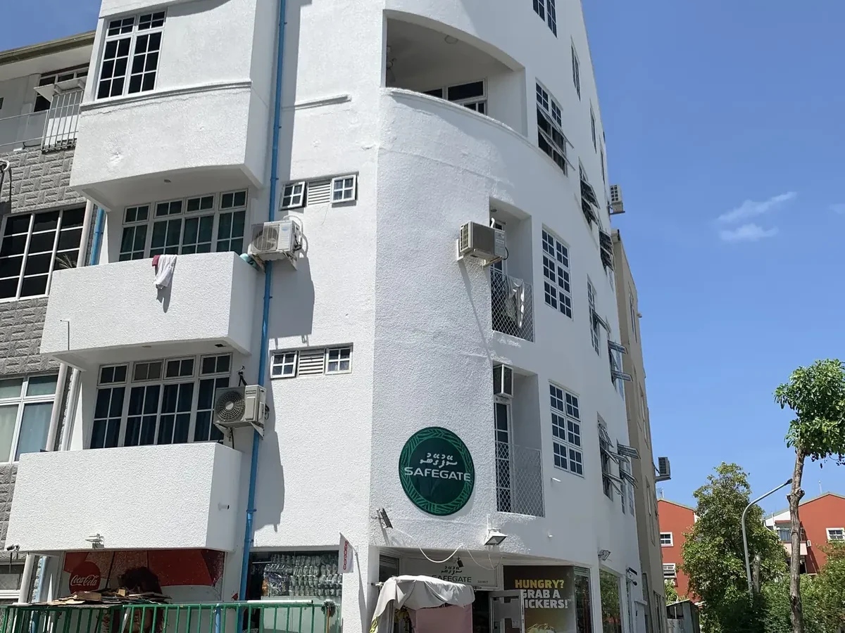 Exterior repainting of a five-storey corner building — Abdulla Haleem, 2021
